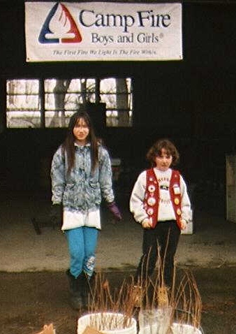 Two campfire girls preparing cuttings for planting.